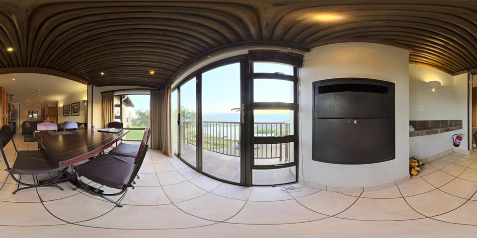 Example 360-degree interior panorama with dining space, glass doors, and a balcony; licensed illustration from Poly Haven.
